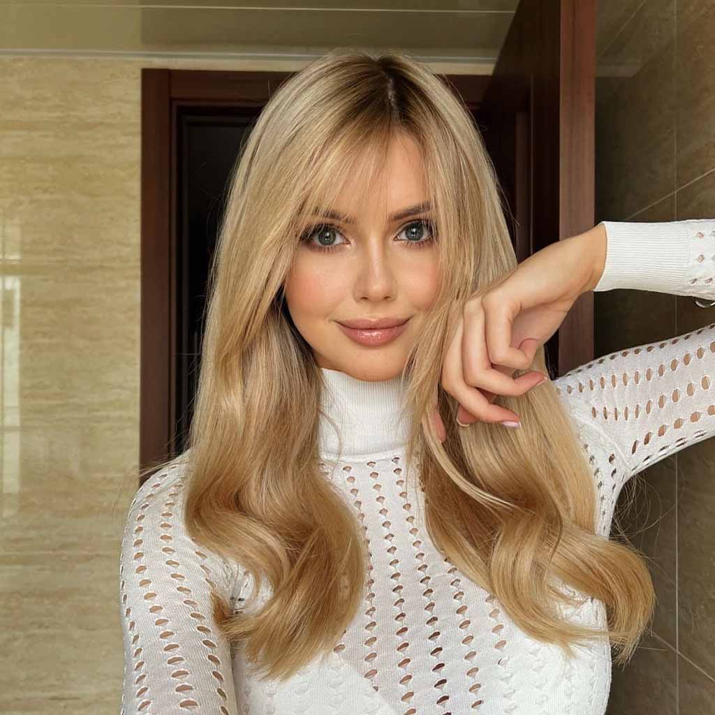 Wavy Blonde Hair With Wispy Bangs