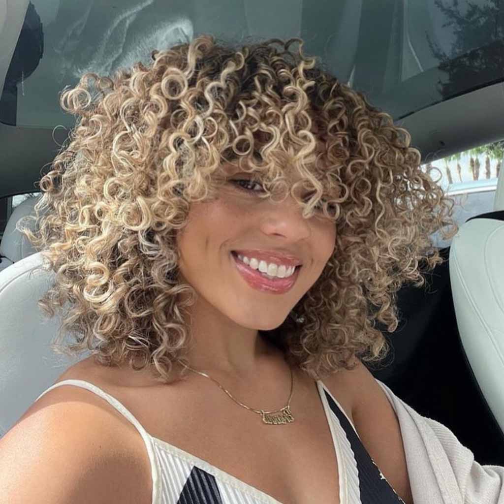 Blonde Spiral Curls With Extended Curly Bangs