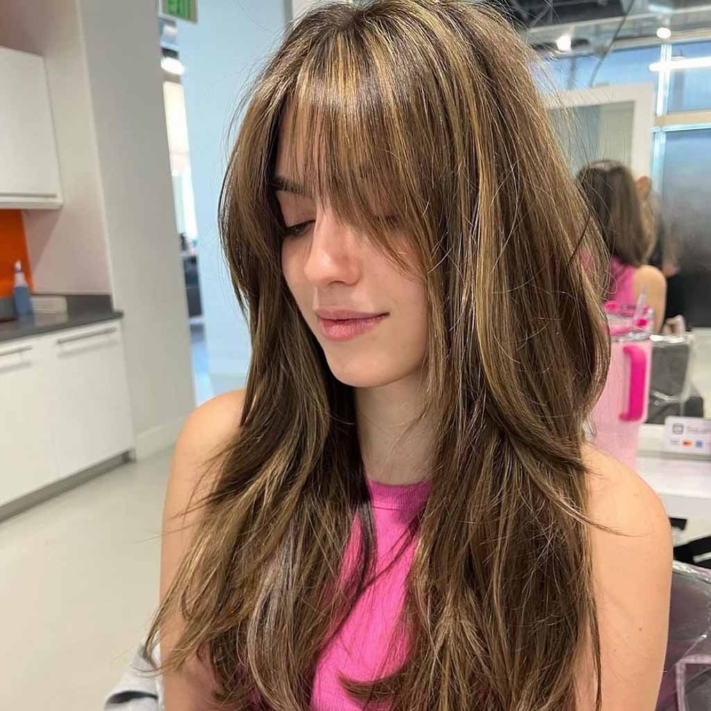 Wispy Bangs With Butterfly Cut and Blonde Highlights