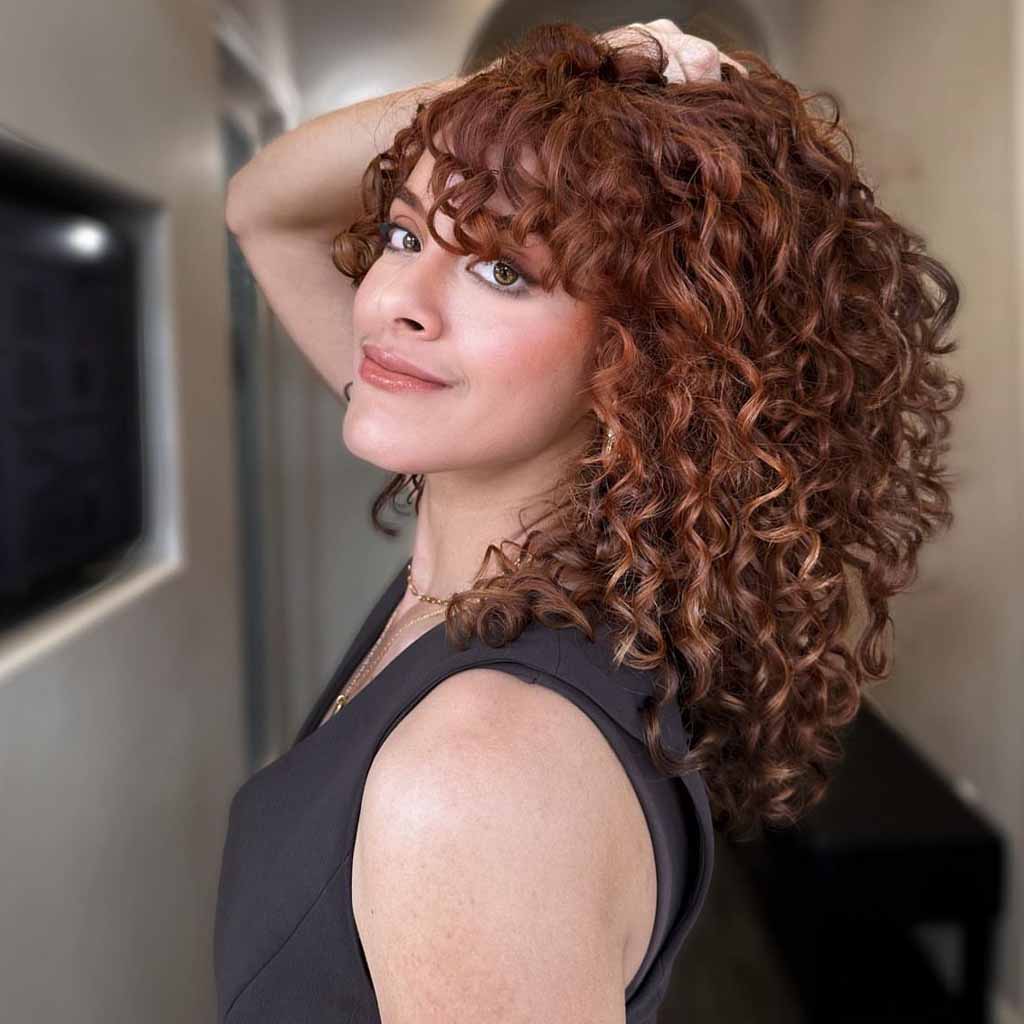 Copper Brown Spiral Hair With Side-Swept Bangs