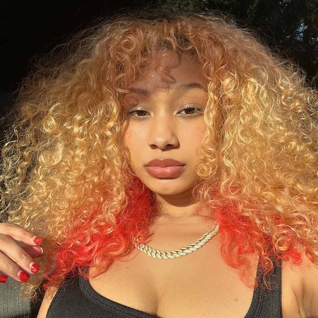 Blonde Long Voluminous Coiled Curly Hair With Red Highlights