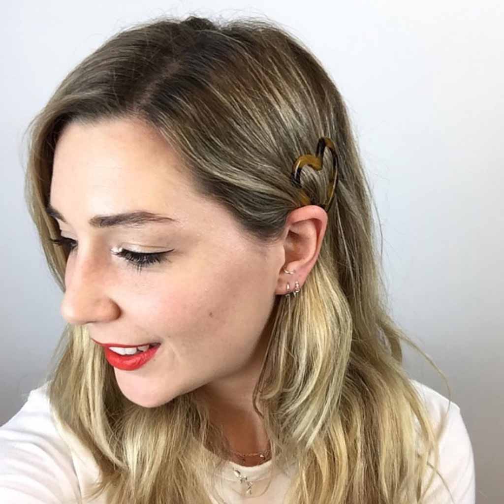 Bronde Hair Tucked Behind the Ear With a Clip