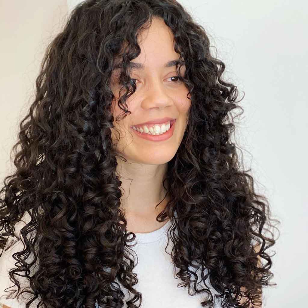 Long Black Layered Curly Hair With Face Framing Layers