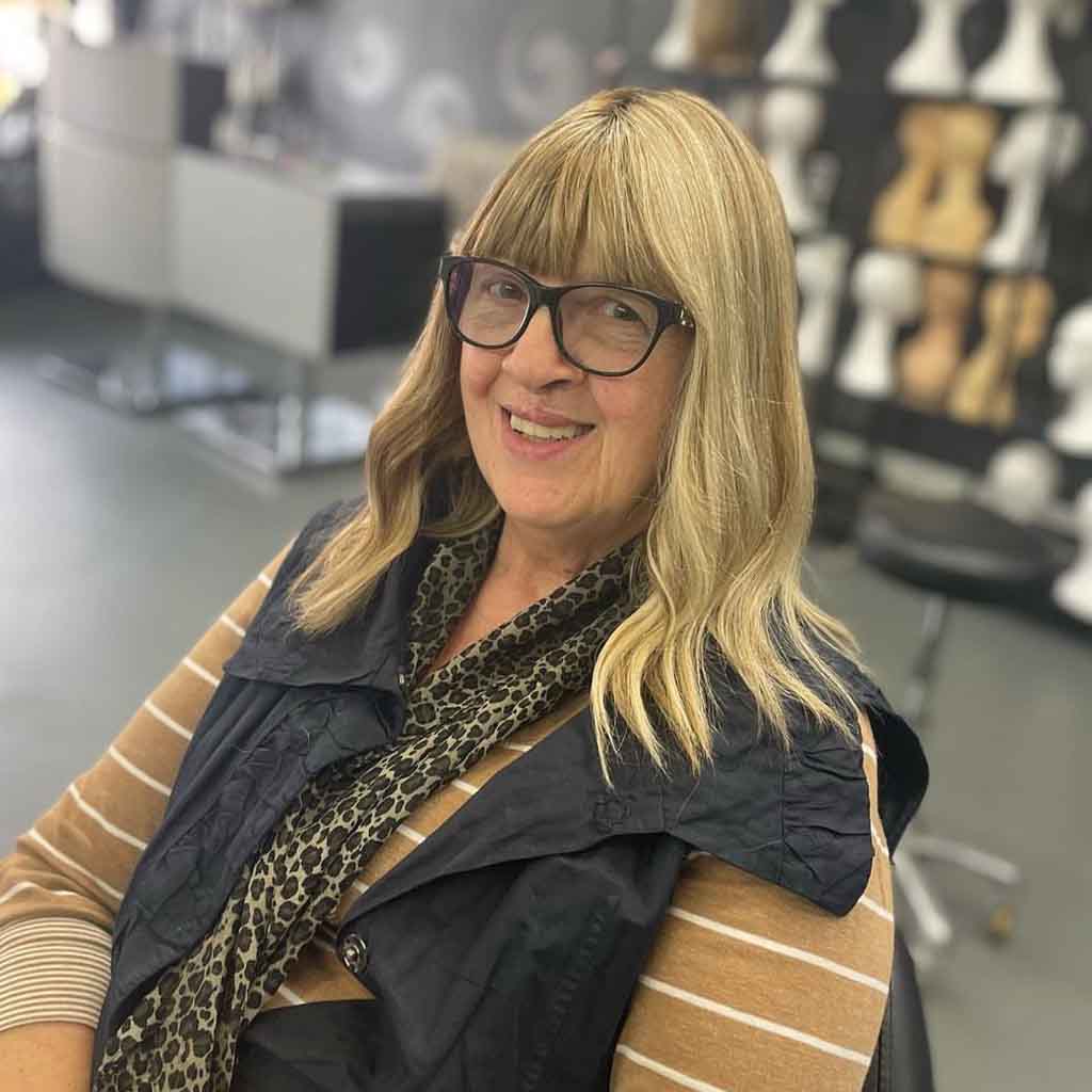 Medium Blonde Wavy Hair With Blunt Bangs