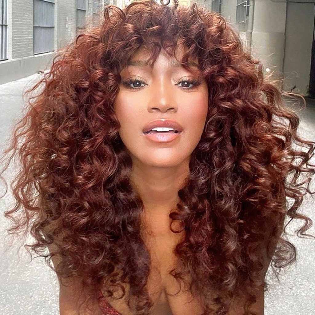 4. Curly Reddish Purple Brown Hair With Curly Wispy Fringes
