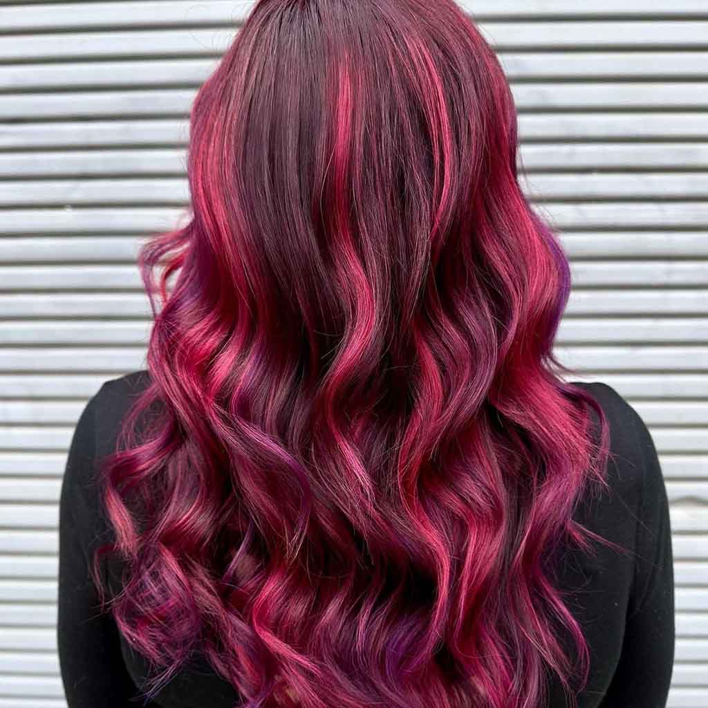 Long Wavy Hair With Cherry Bomb and Purple Highlights