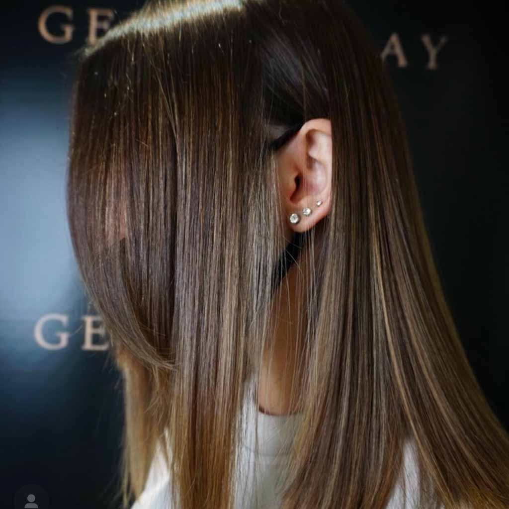 Medium Length Balayage Hair Tucked Behind the Ear
