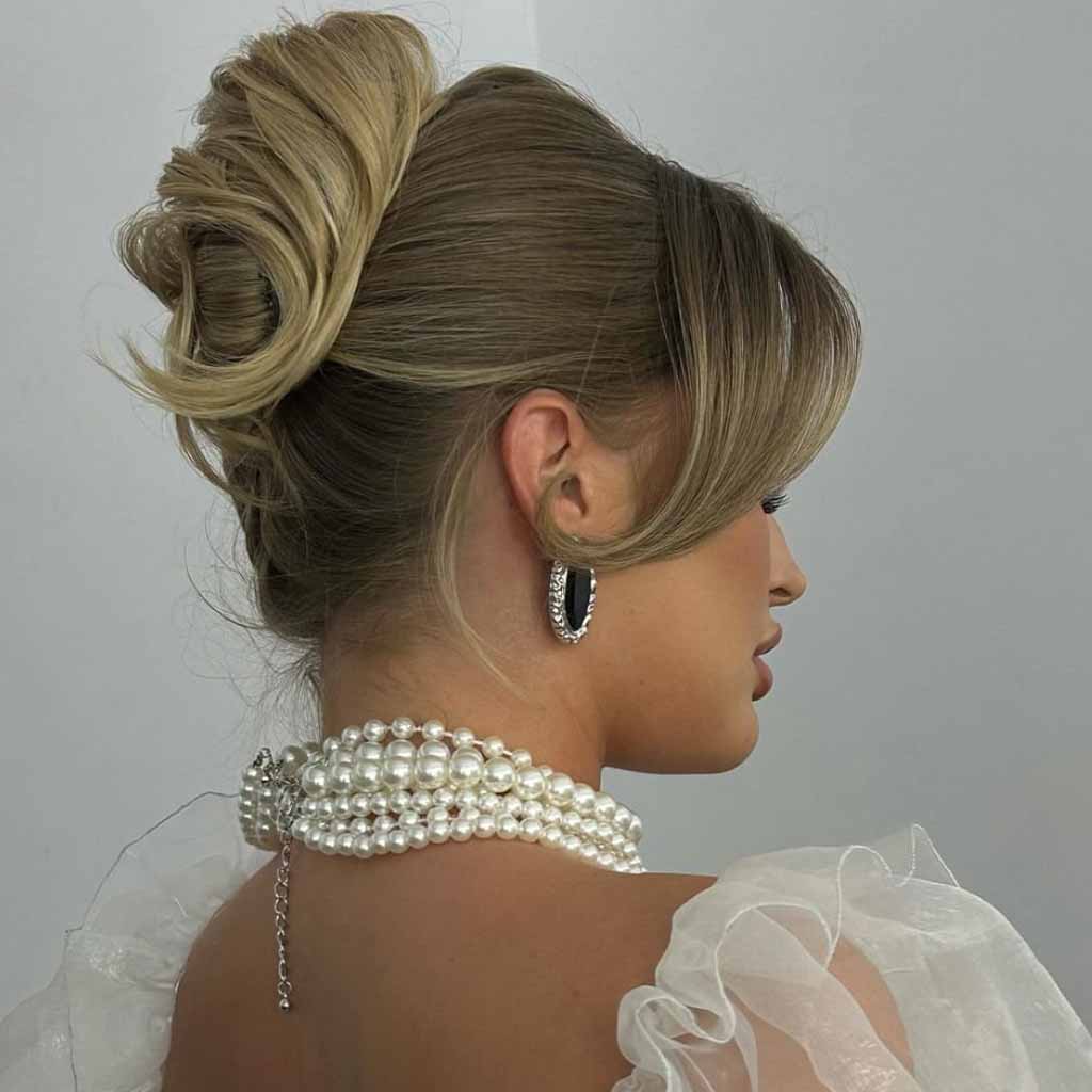 Top Bun With Side-Swept Bangs