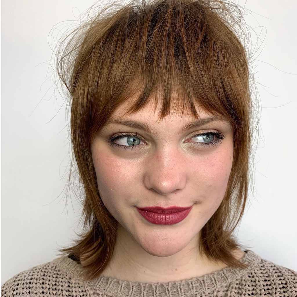 Textured Razor Shag Hair Cut With Asymmetric Bangs