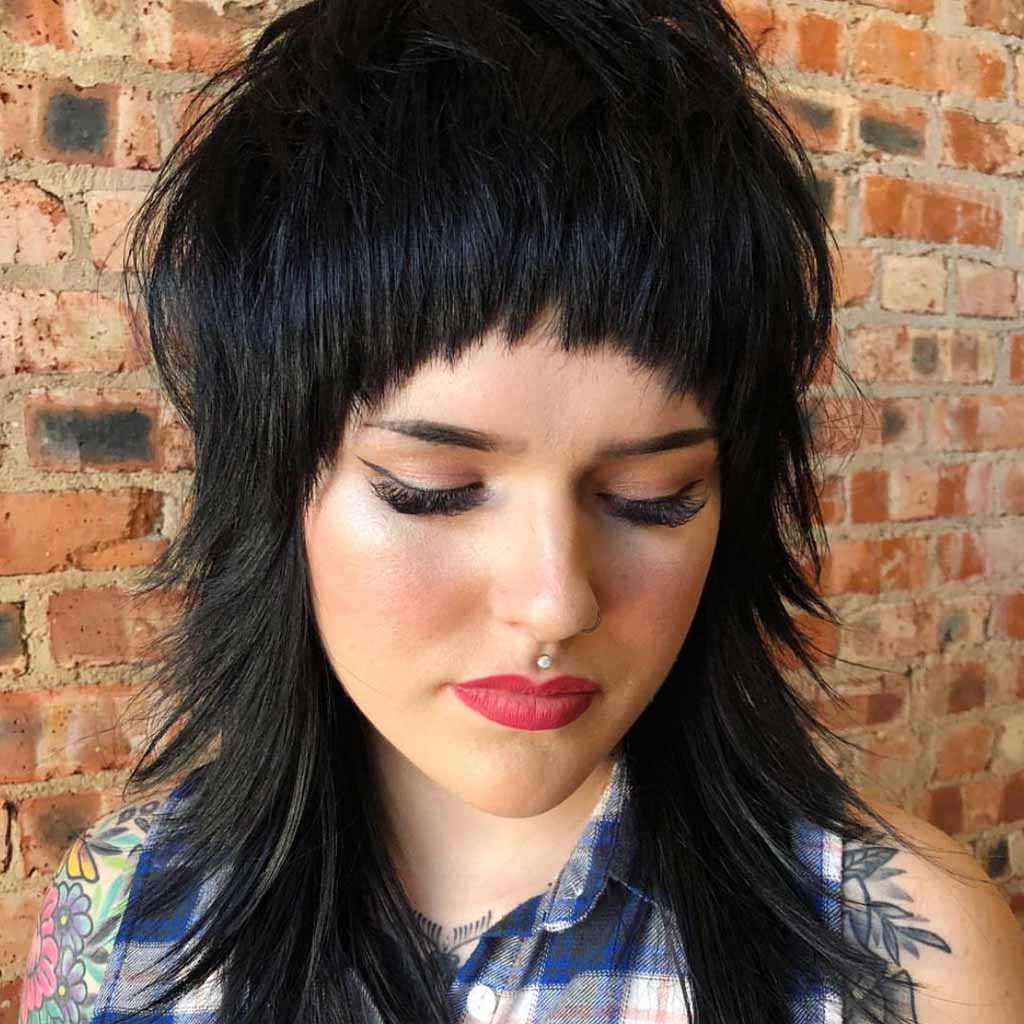 80’s Inspired Razor Shag Cut With Asymmetric Blunt Bangs