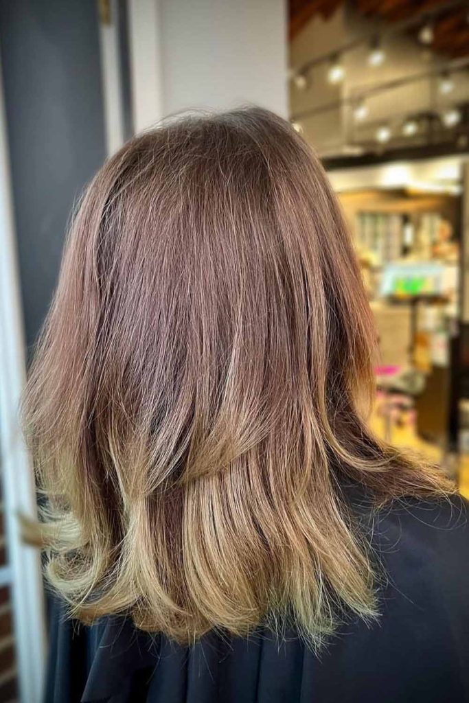 Medium Brown Layered Haircut With Blonde Highlights