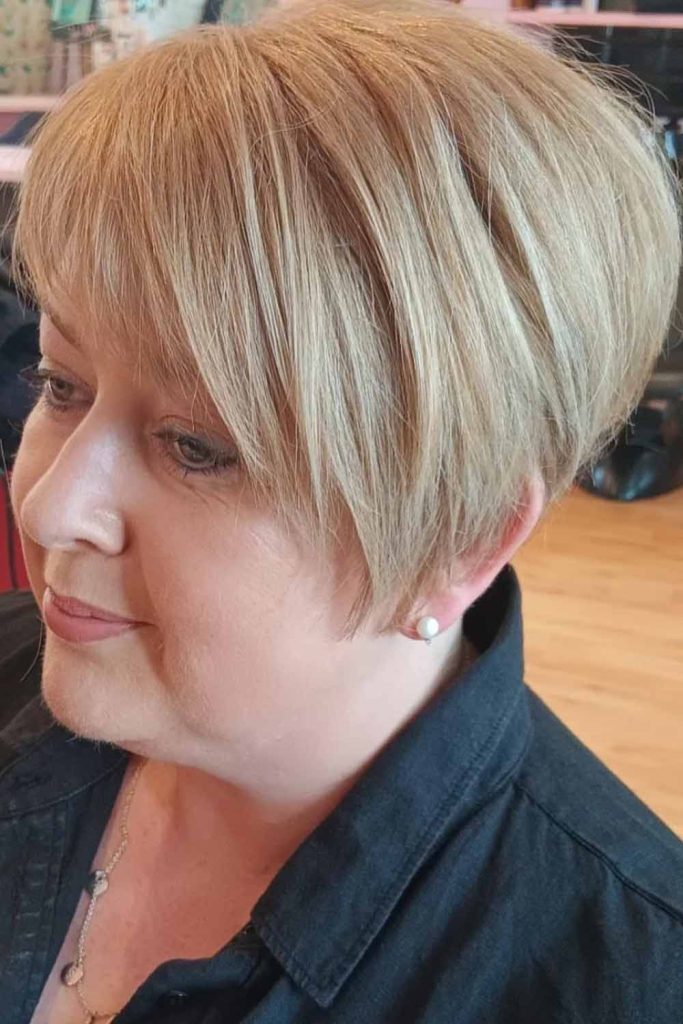 Side-Swept Blonde Pixie Cut with Extended Bangs