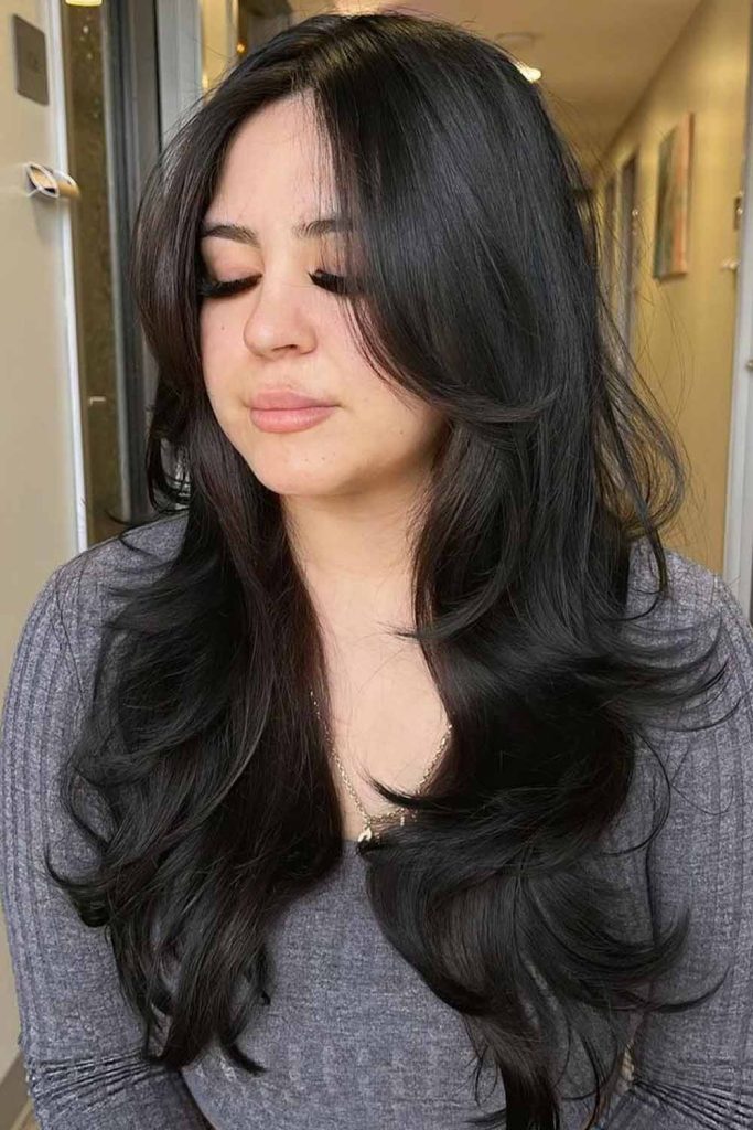Sleek Black Layers With Feathered Ends