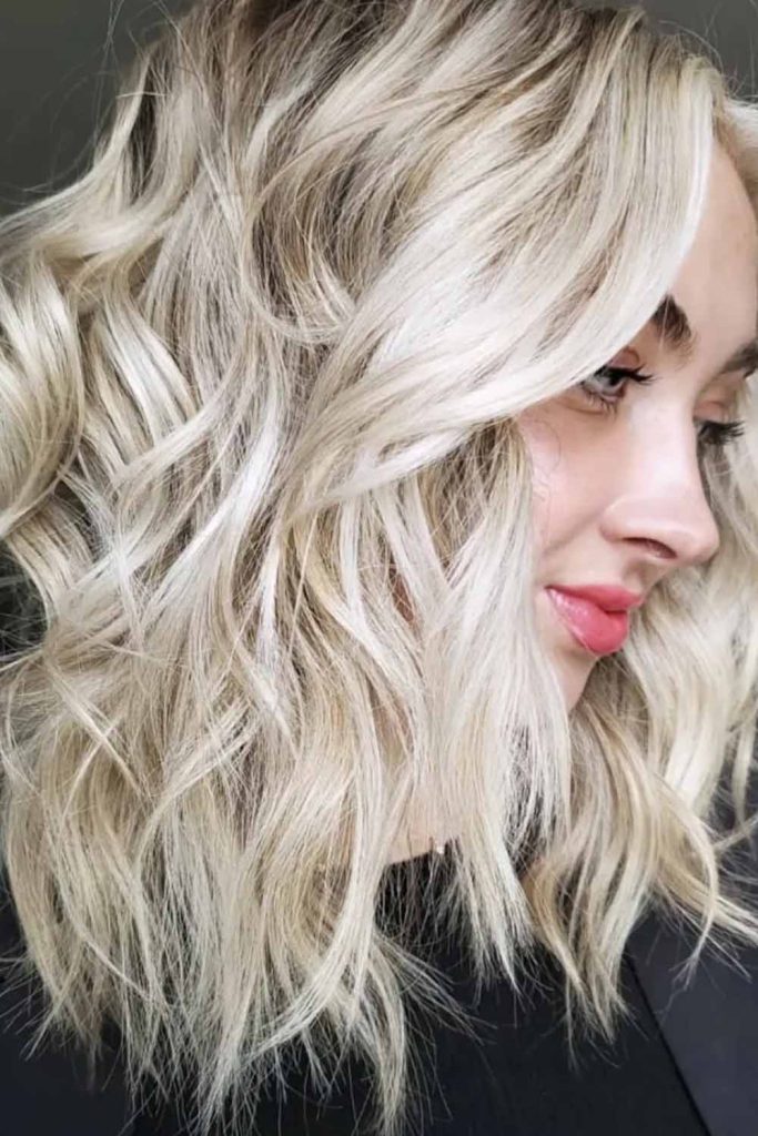 12. Blonde Curly Shattered Lob