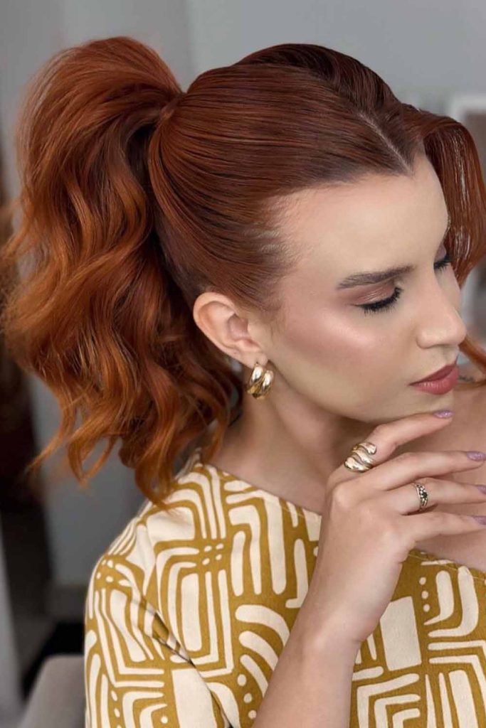 High Voluminous Ponytail With Rich Auburn Curls