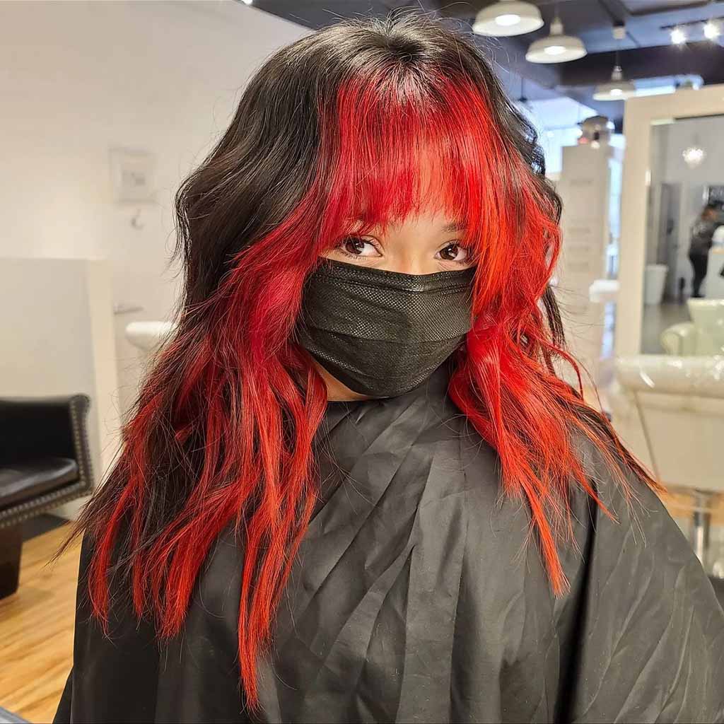 Fluffy Mullet Wolf Cut With Choppy Bangs, Subtle Waves and Red Highlights