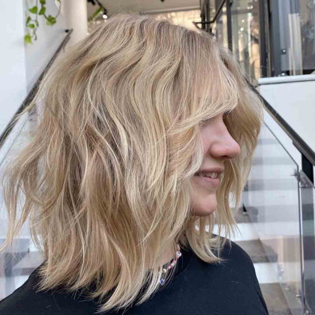 Medium Wavy Wolf Cut on Bronde Hair