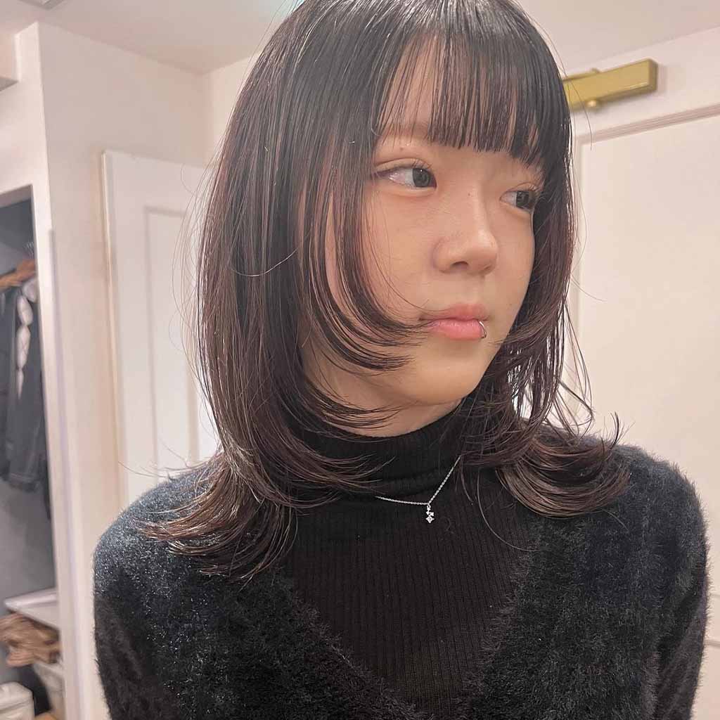 Medium Wolf Cut With Face Layers and Choppy Bangs