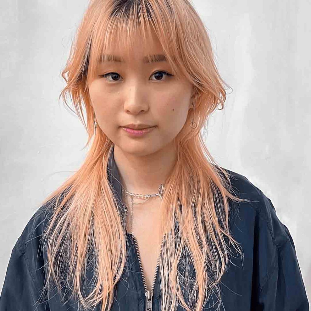 Jellyfish Wolf Cut on Peach Hair With Wispy Bangs