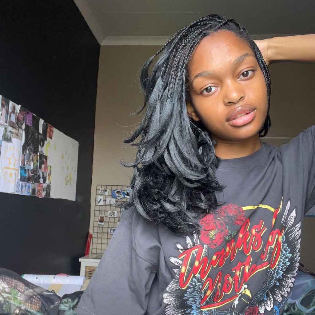 14. Layered Wolf Cut Medium Hair With Braids