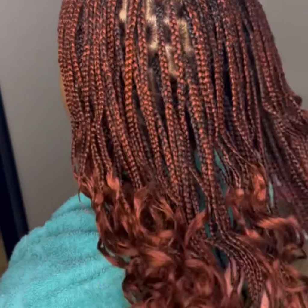 15. Auburn Wolf Cut Braids on Wavy Hair