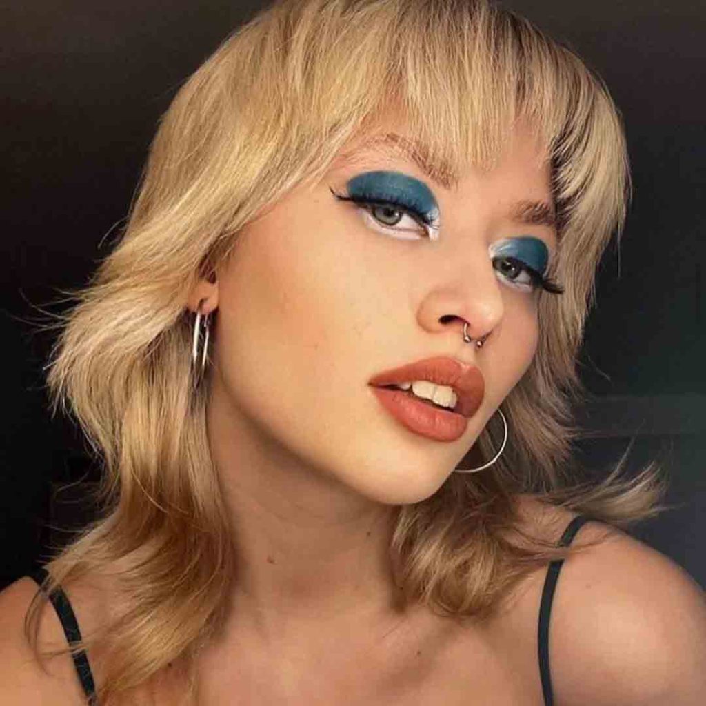 Blonde Wolf Cut With Brown Highlights and Asymmetric Bangs