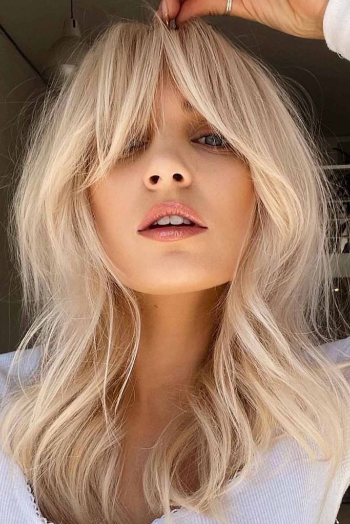 Curtain Bangs on Bleached Blonde Shag Hair
