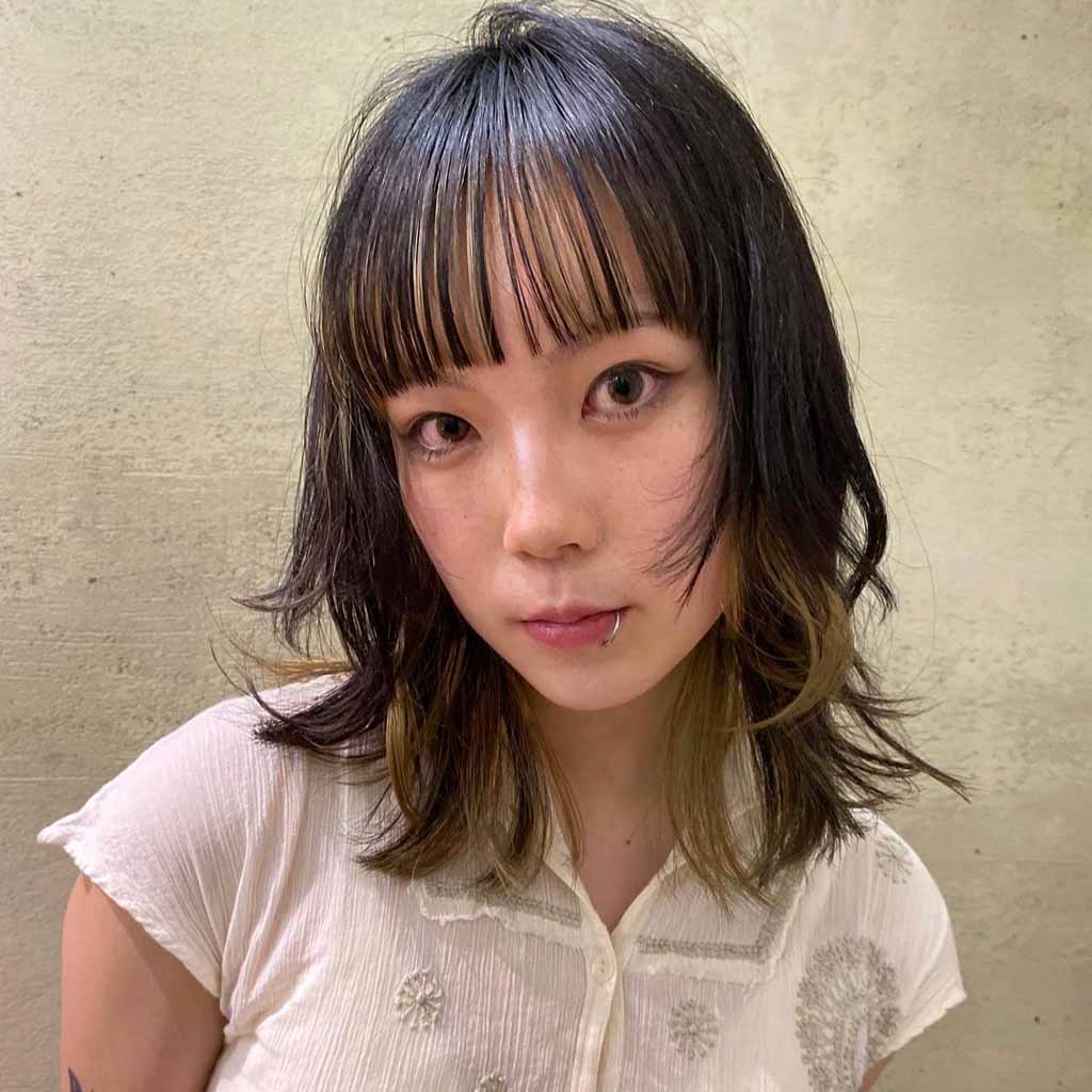 Layered Medium Length Wolf Cut With Choppy Bangs and Bronde Ends