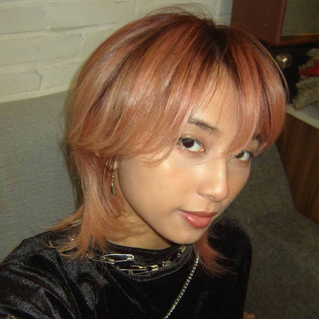 Rose Gold Pixie Wolf Cut With Side-Swept Bangs