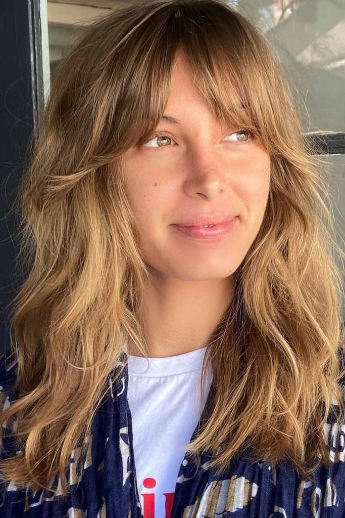 Textured Hair With Soft Layers and Curtain Bangs