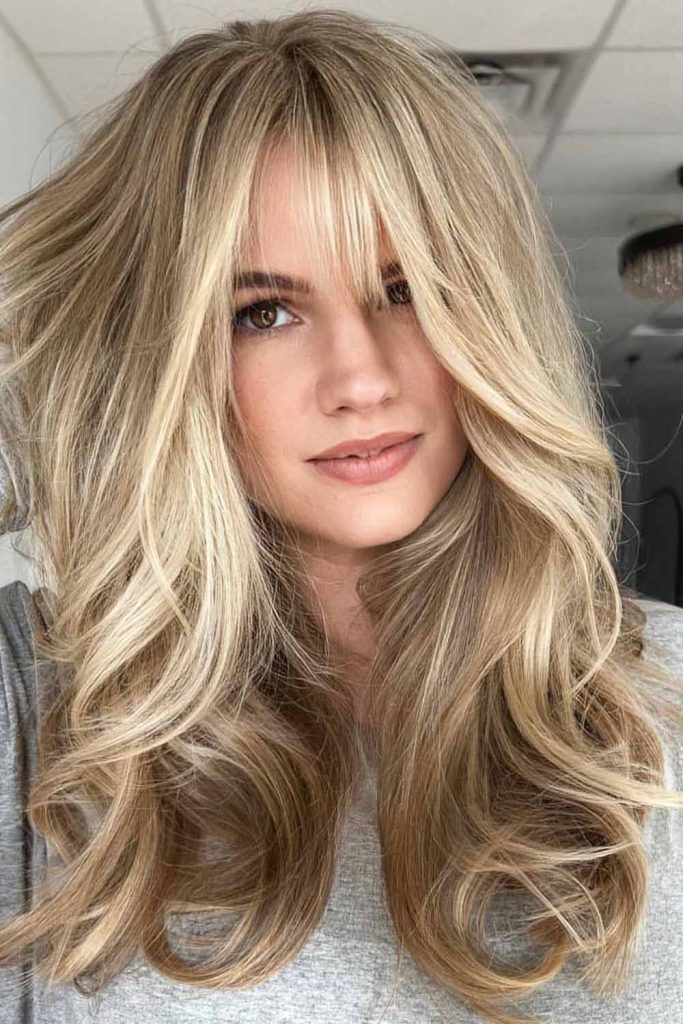 Blonde Baby Lights With Long Layers and Curtain Bangs