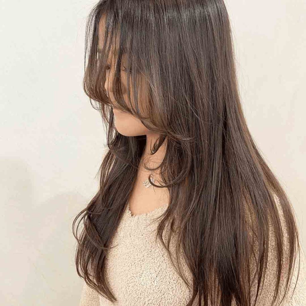 Long Wolf Layered Cut With Wispy Bangs