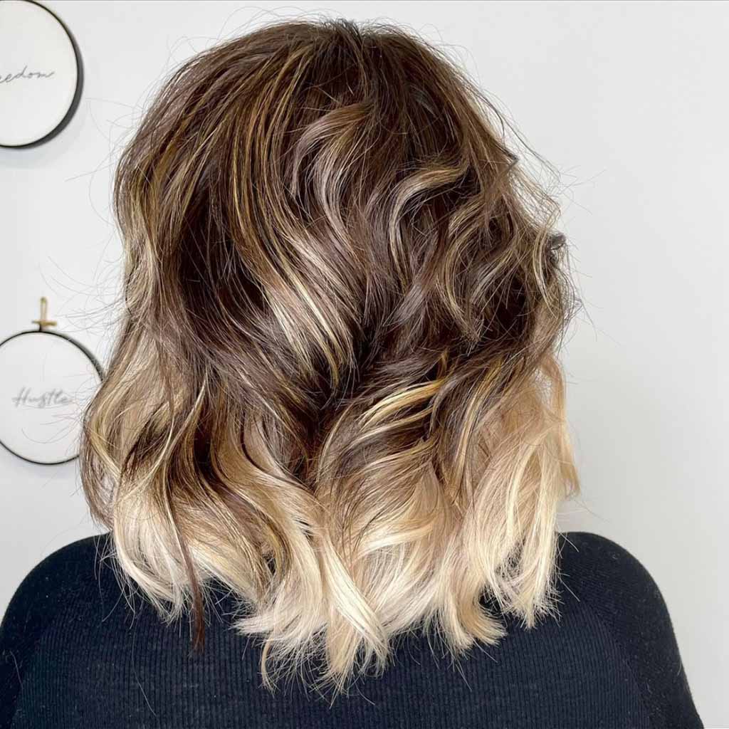 Peek-a-Boo Blonde and Brown Medium Wavy Wolf Cut