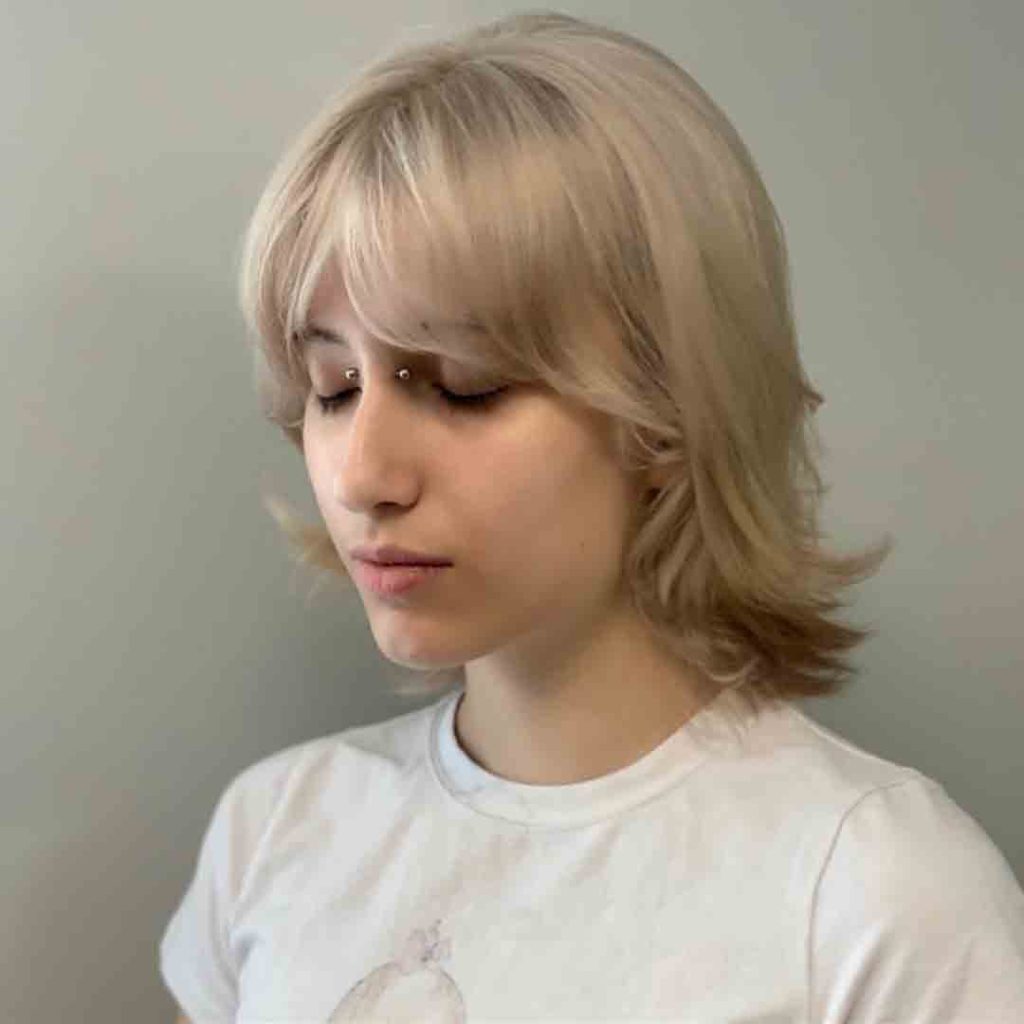 Short Blonde Wolf Cut With Side Swept Bangs
