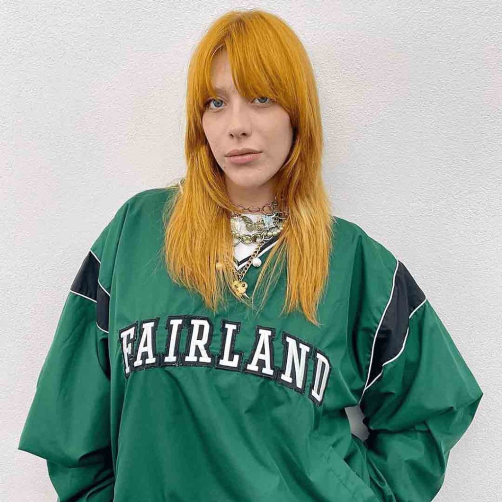 Wolf Cut on Long Yellow Hair With Side-Swept Bangs