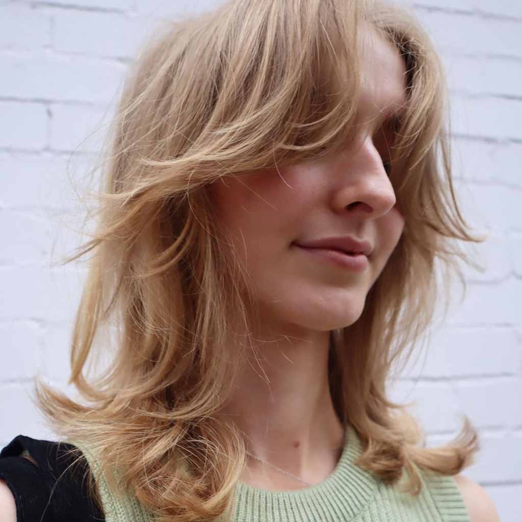 Blonde Mullet Wolf Cut With Wavy Curtain Bangs