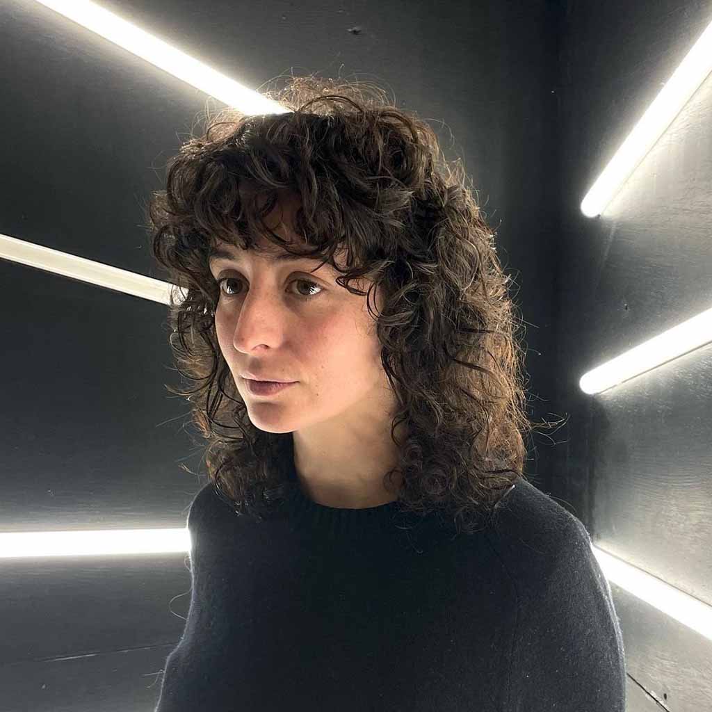 Mullet Wolf Cut on Curly Hair With Curly Bangs