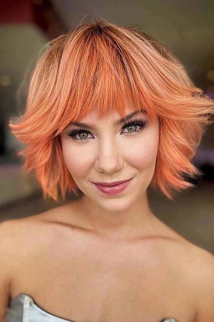 Orange Pixie Blowout Haircut With Bangs and Layers